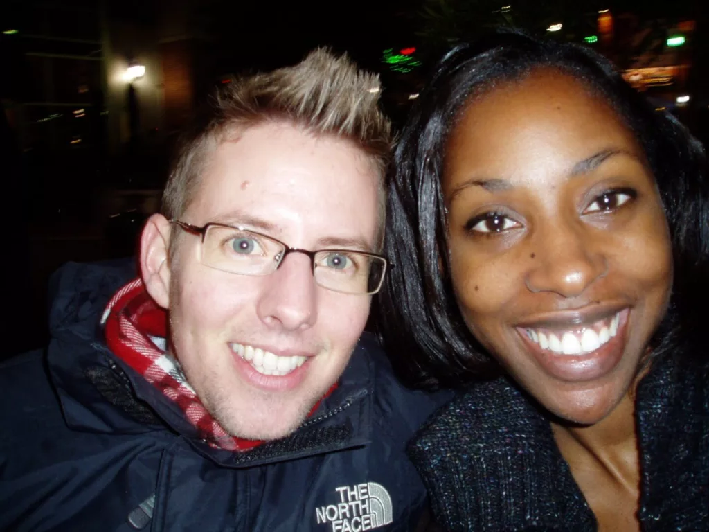 A man and woman smile for the camera.
