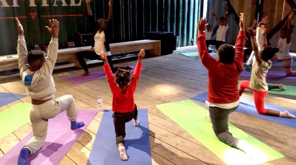 ProjectYogi.header_grande A group of people doing yoga on mats.