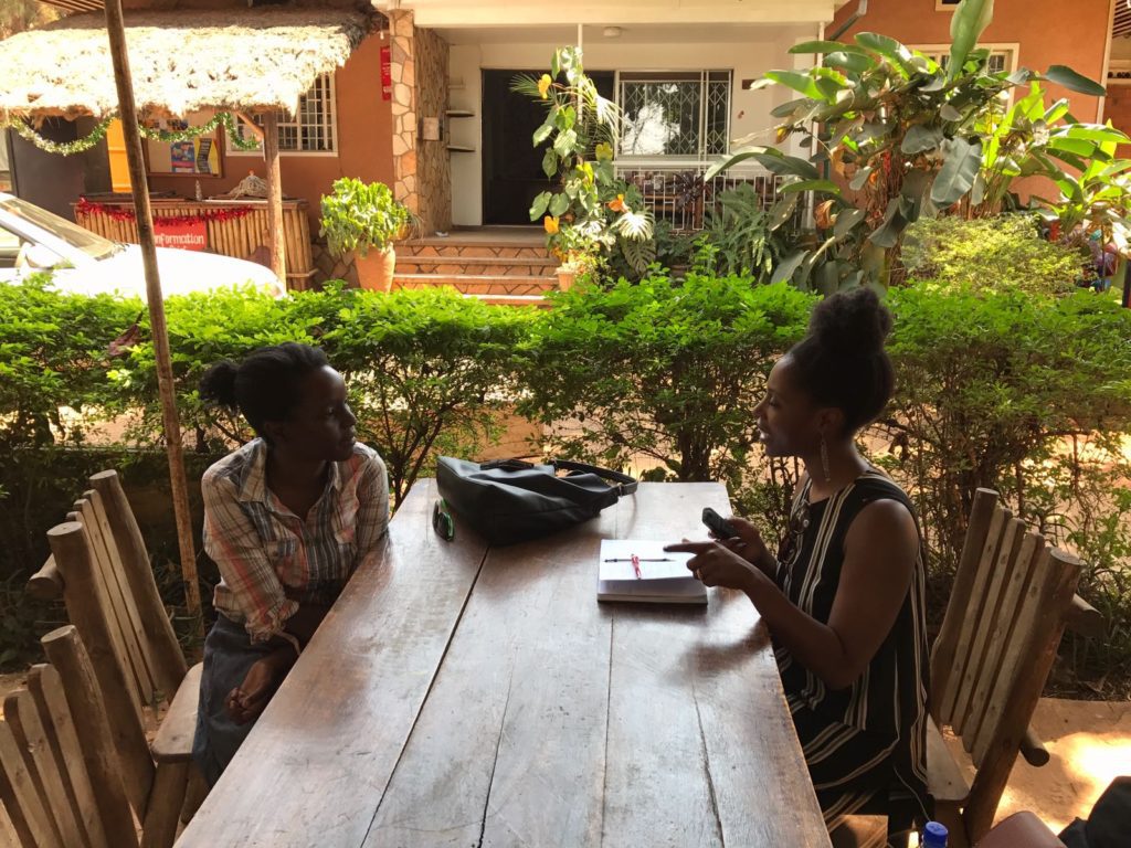 A pink logo for 9 9 u