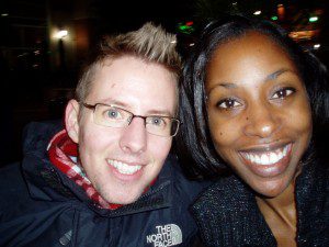 A man and woman smile for the camera.